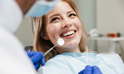 Lady smiles at dentist