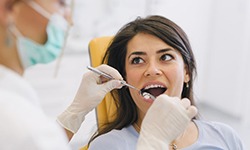 a patient undergoing a dental checkup and cleaning 