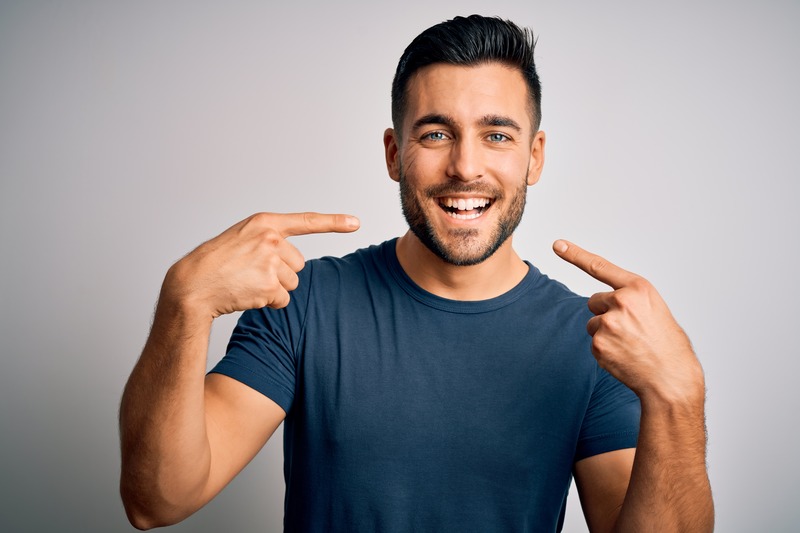 Patient smiling after teeth whitening